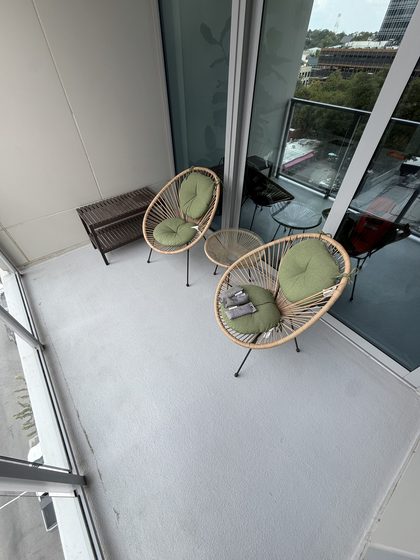 Balcony after cleaning &mdash; floor an even light grey with the grime film removed.